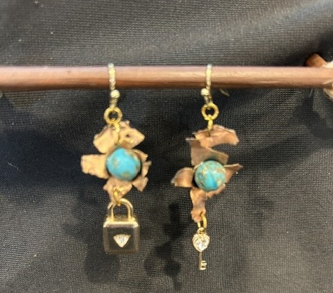 Layered vintage brass chain necklace with charm